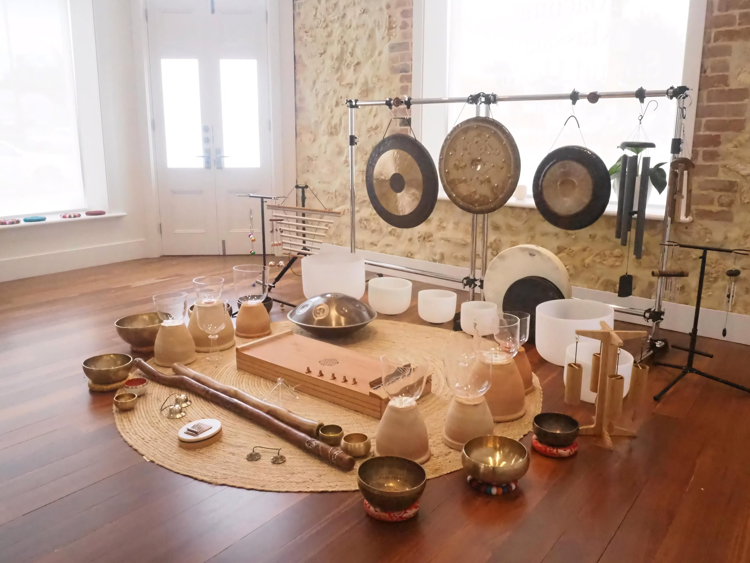 Gongs, singing bowls, chimes and a monochord arranged for a sound meditation session.