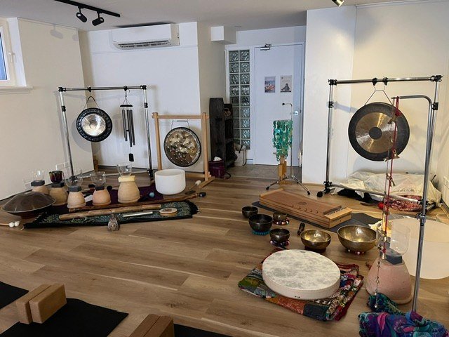Gongs, bowls, drums and a monochord set out in the State of Zen studio.